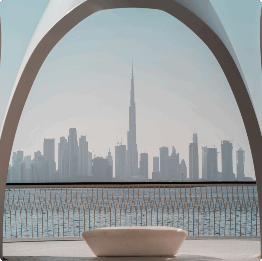 Framed view of Dubai skyline and Burj Khalifa from waterfront arch, symbolising modern business and bookkeeping services in Dubai.