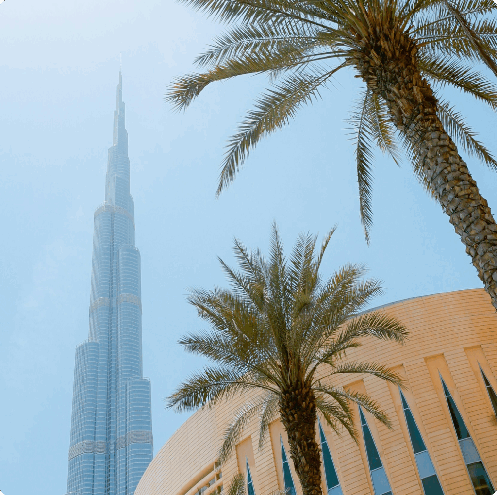 View of Burj Khalifa with palm trees in foreground, representing Dubai’s position as a global hub for crypto company formation.