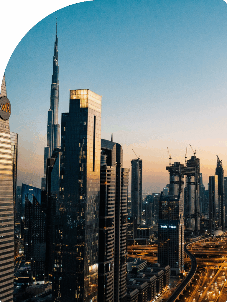 Dubai skyline at sunset with Burj Khalifa, showcasing the central location advantage of mainland company formation in the UAE.