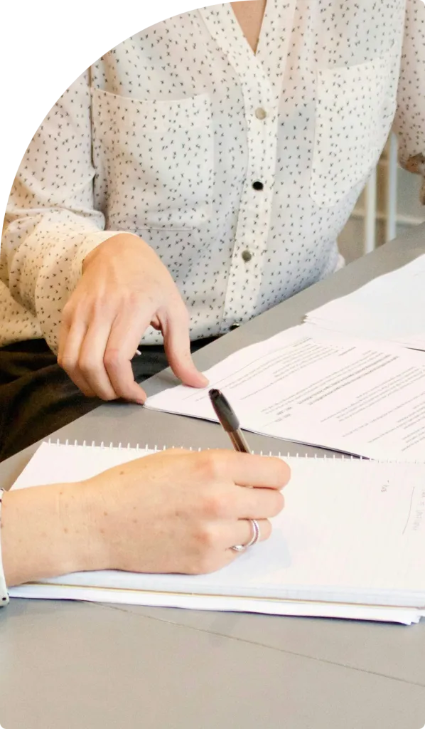 Business professionals reviewing paperwork during a consultation for VIP residence visa in Dubai