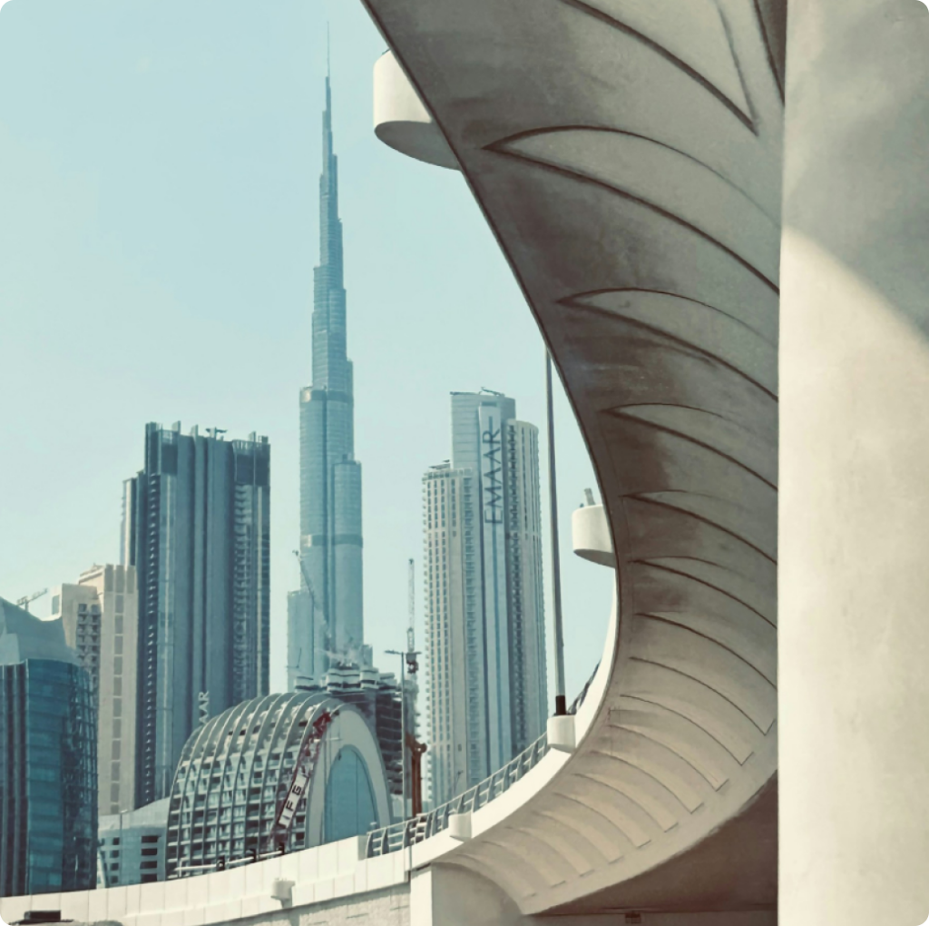 A stunning view of Burj Khalifa framed by modern architectural curves, capturing the essence of Dubai’s skyline and urban innovation.