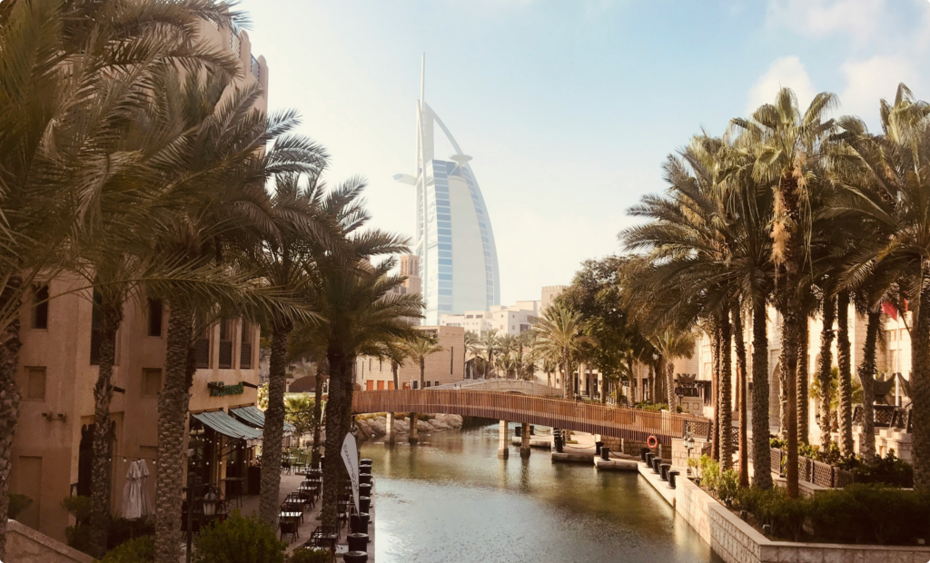 A scenic view of Dubai’s Madinat Jumeirah with the iconic Burj Al Arab in the background, symbolizing luxury, exclusivity, and high-end business opportunities in the UAE.