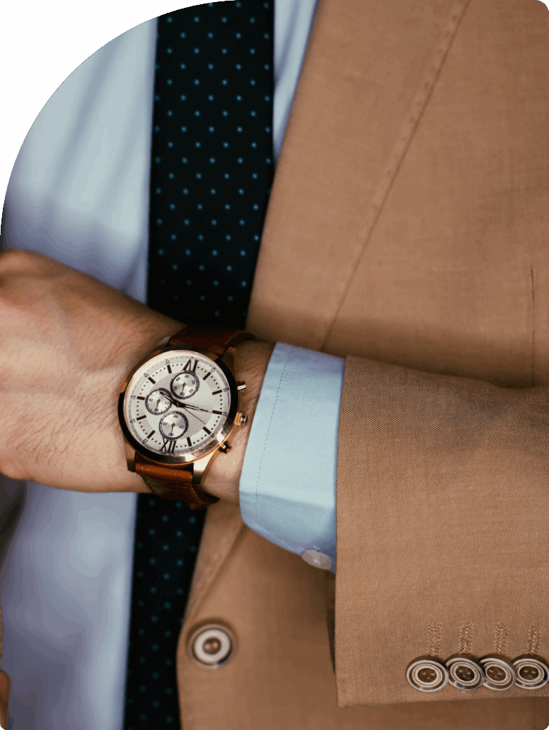 Close-up of elegant wristwatch on businessman in a suit, symbolising wealth preservation through a Cyprus international trust setup.