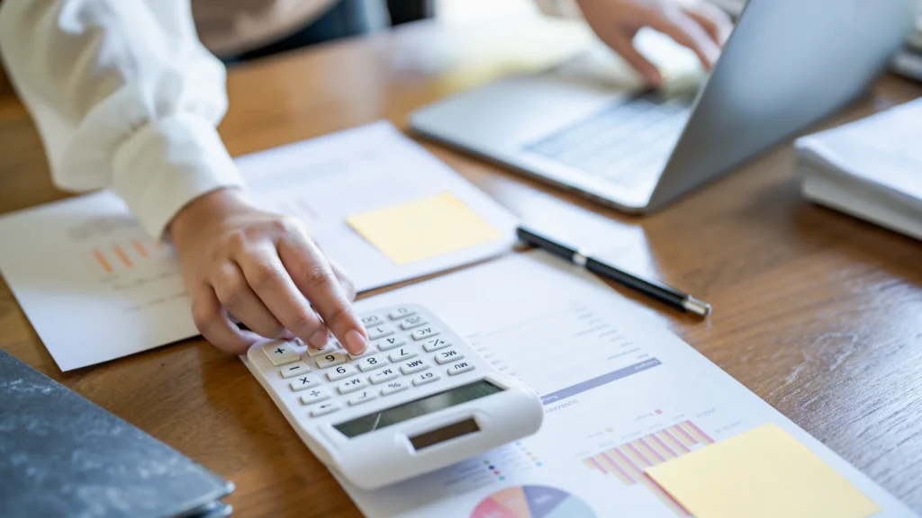 person calculating and managing assets