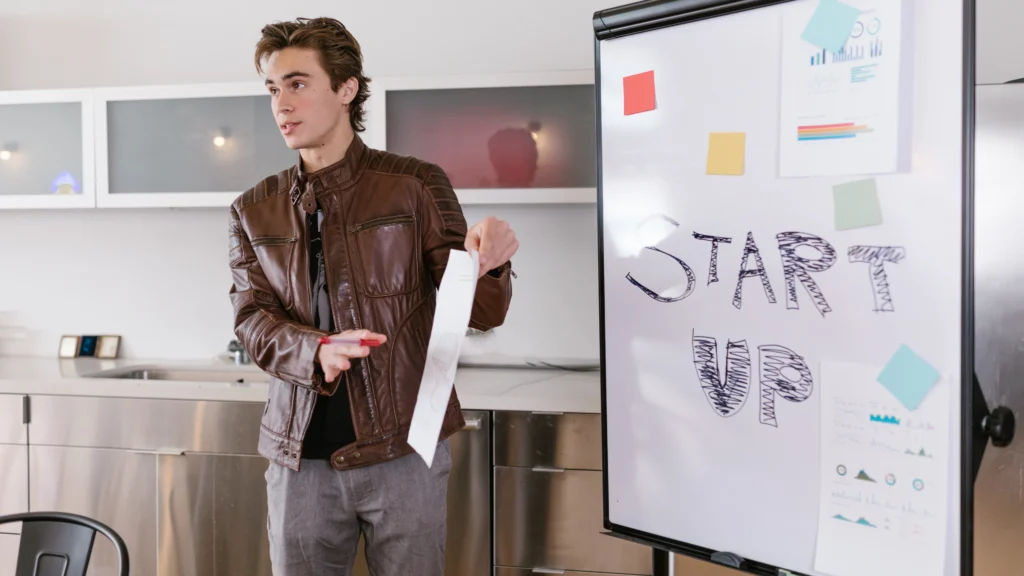 a man presenting information to fellow workers for a startup