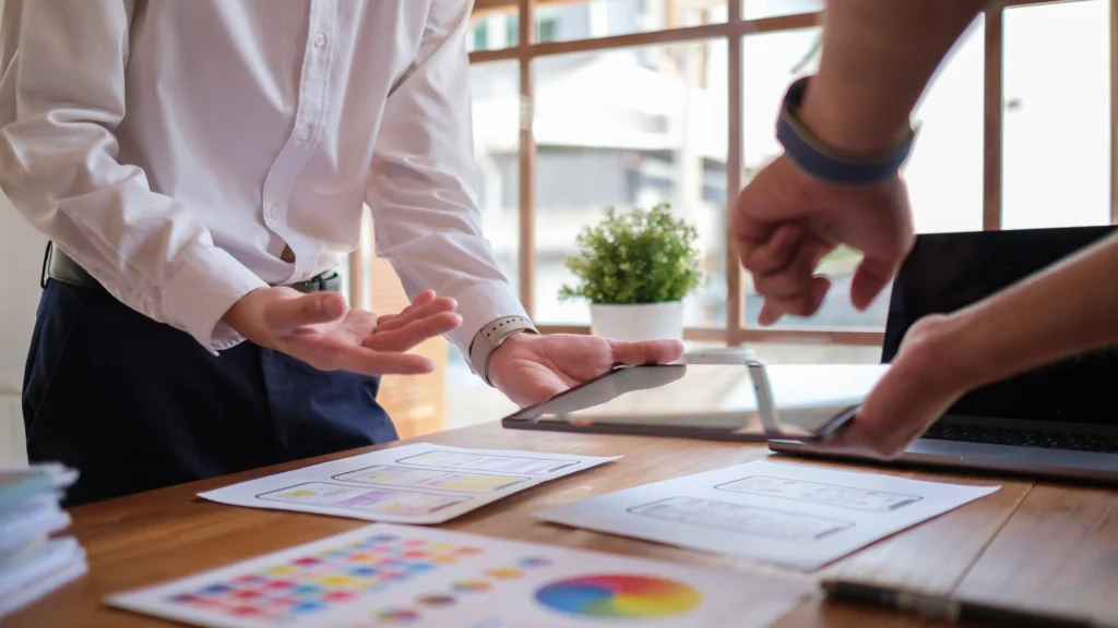 a fund manager going over information with a client during a meeting