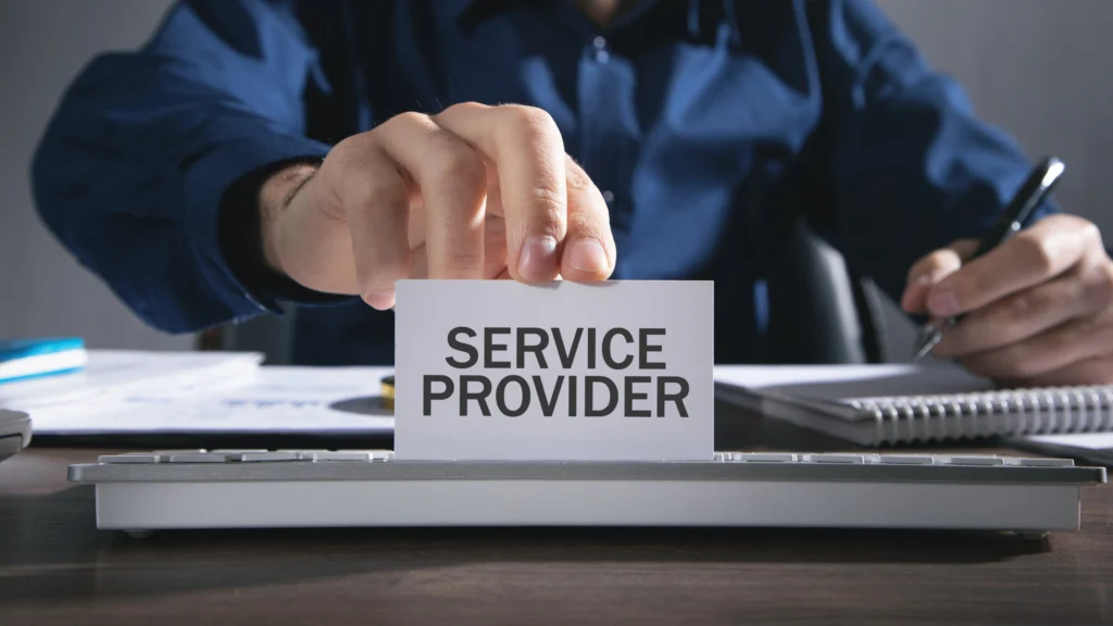 man holding up a card that says service provider on it