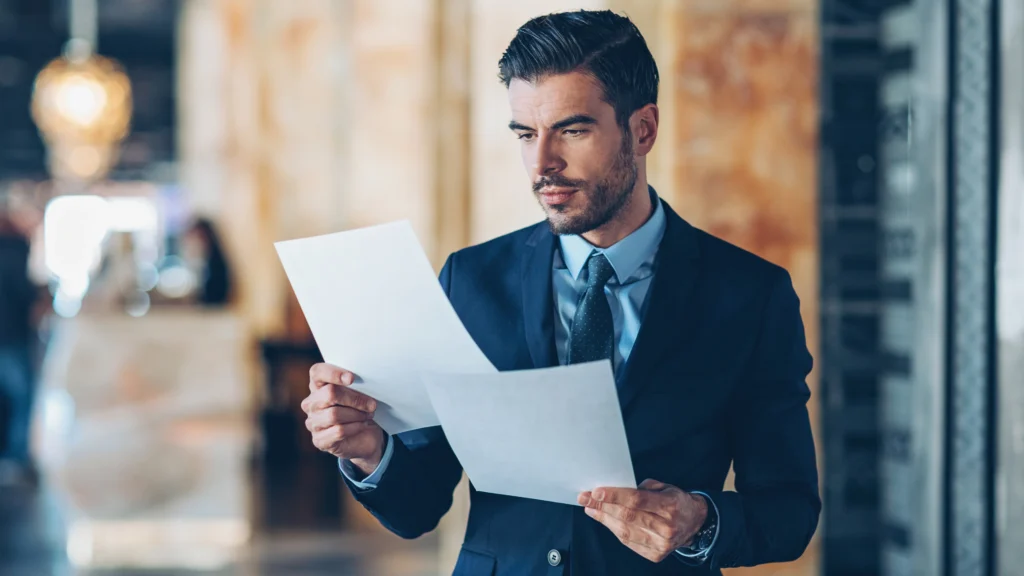 an investor reading through an important document for work