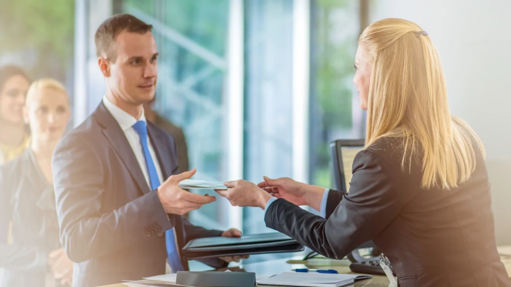 A man and a woman conducting business inside the bank