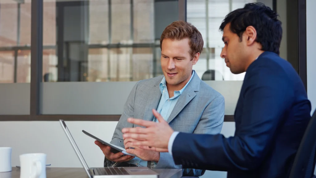 a stakeholder providing feedback about work to a businessman