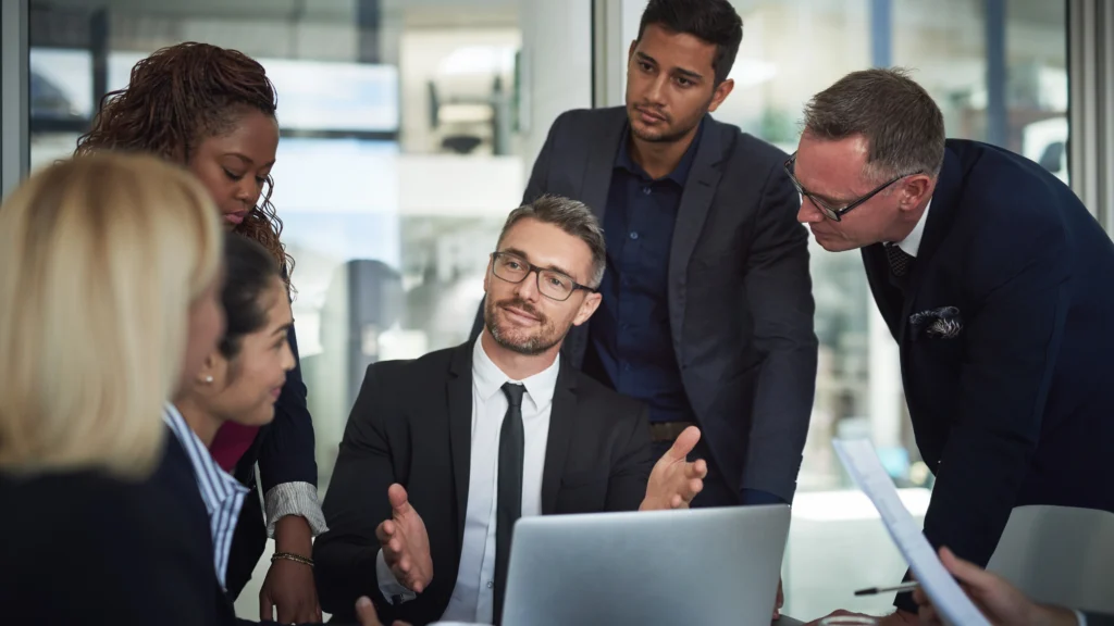 a manager talking to his employees to get them to understand something about work