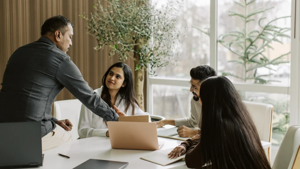 employees having a meeting and talking about strategy