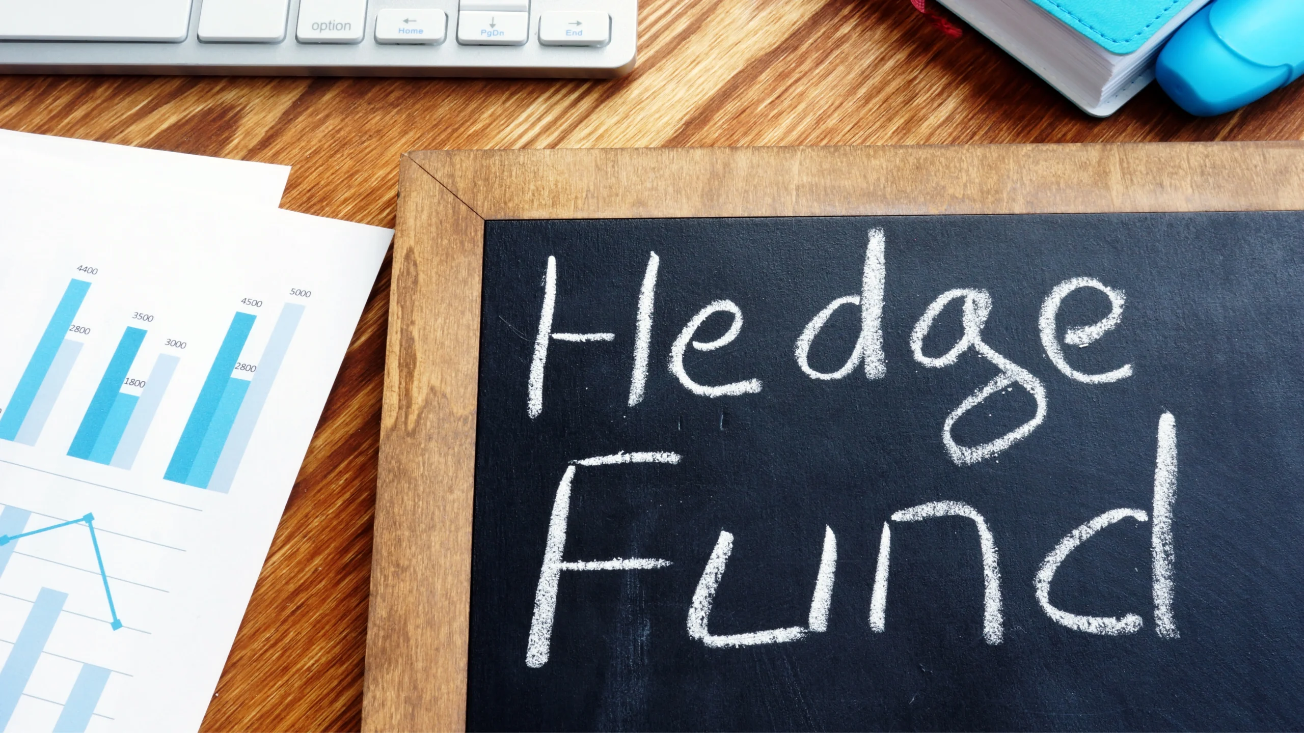 a table with documents on it, as well as a board with hedge fund written on it