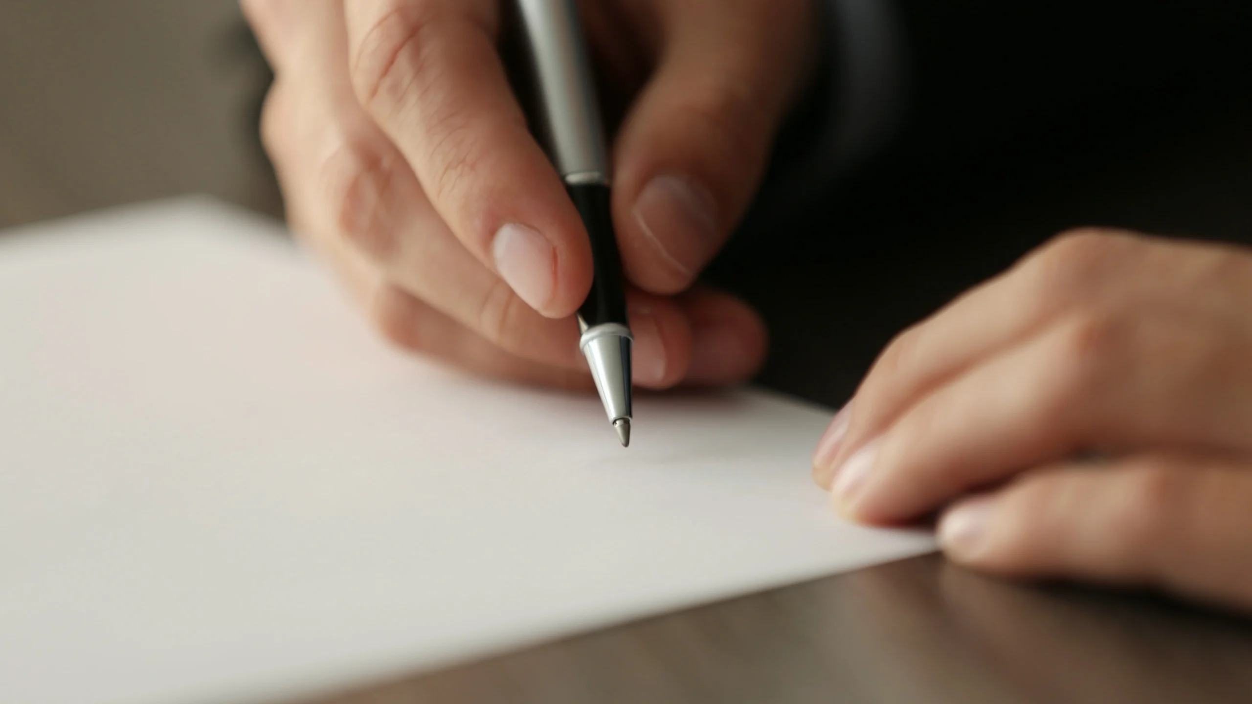 man signing documents for the licensing process