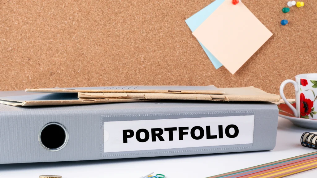a large folder on a desk that says portfolio on it