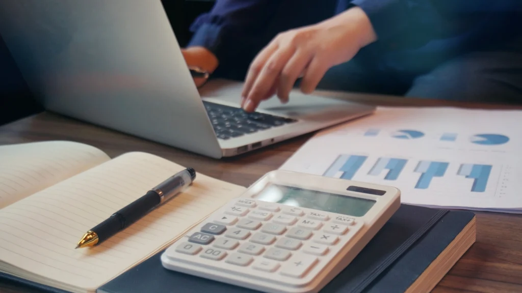 a man calculating all costs and factors for work processes