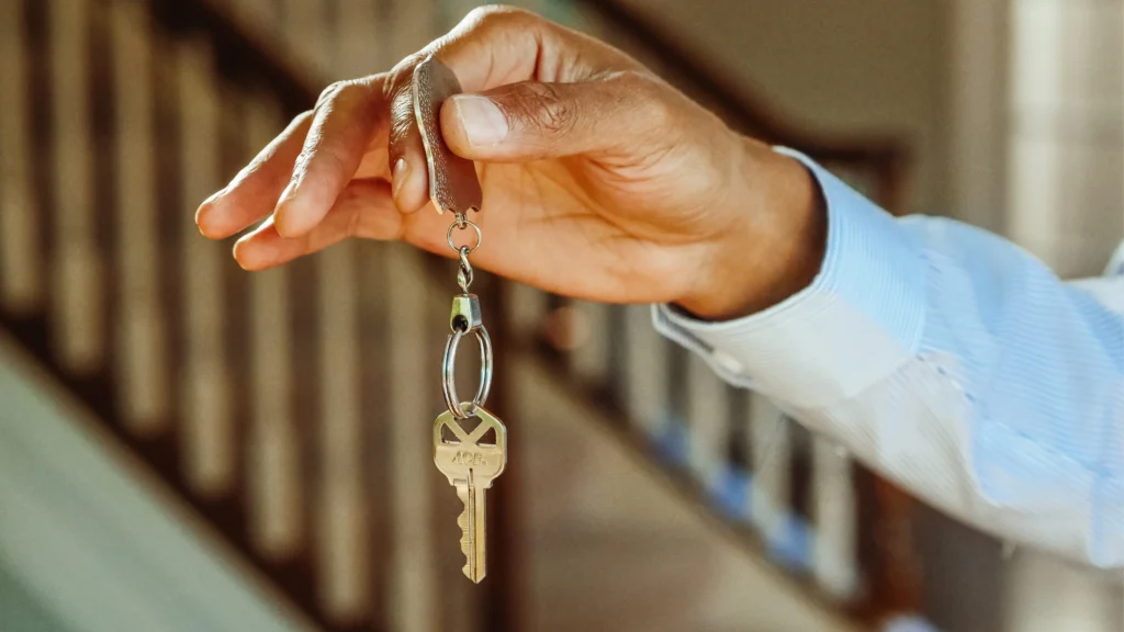 person handing keys to someone so they have full control