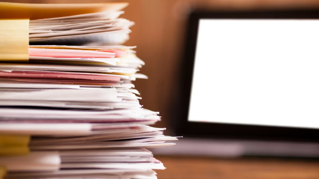 important work documents in front of a work laptop