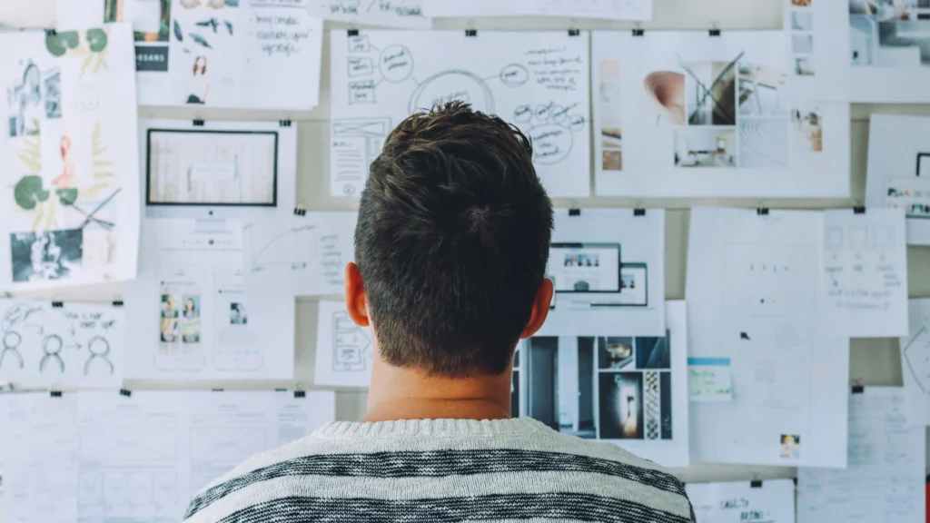 a man planning out details for his startup