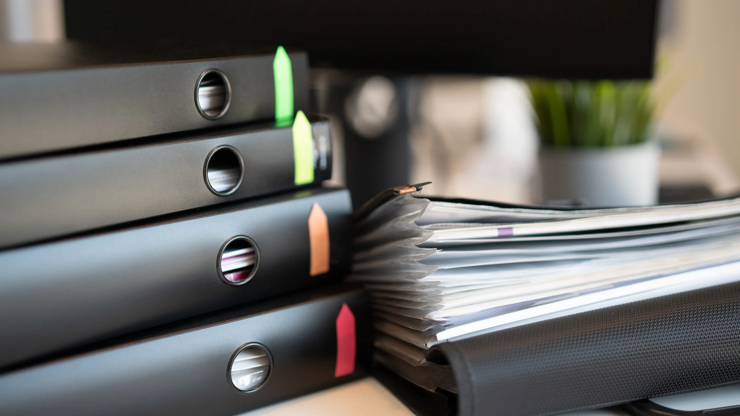 five folders loaded with all kinds of documents important for work